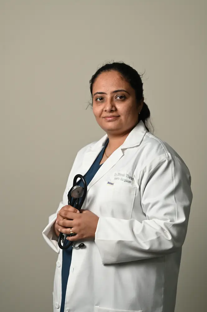 Doctor in a white coat at Pluto Hospital, Himatnagar